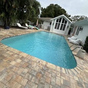 inground pool being cleaned