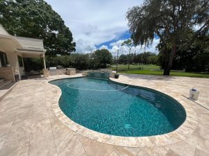 inground pool being cleaned